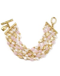 Twisted strands of pearl, pink jade and resin add sweet bohemian drama to everyday ensembles. Tap this Lauren Ralph Lauren bracelet for a layered and luminous look.