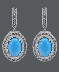 Tantalize the senses with this tasteful style. Carlo Viani's delightfully dramatic drop earrings feature oval-cut turquoise (8 mm) surrounded by rings of round-cut blue topaz (1-1/3 ct. t.w.) and white sapphire (2-1/2 ct. t.w.). Crafted in 14k white gold. Approximate drop: 1-1/2 inches.