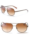 Tory Burch's aviator sunglasses have a 4 T-pattern engraved on temples. Adjustable nose pads help to secure fit. UV 400.