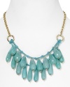 Take this season's love of bold colors to your jewel box with this beaded bib necklace from Aqua, accented by a cluster of turquoise drop beads and a textured chain.