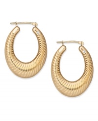 True craftsmanship. Scalloped edges and a chic oval shape add just the right detail to this stunning pair of hoop earrings by Signature Gold™. Crafted in 14k gold. Approximate drop length: 1-1/8 inches. Approximate drop width: 3/4 inch.