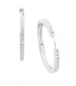 Timeless style with a hint of sparkle. Eliot Danori's traditional hoop earrings experience a dazzling touch with the addition of a seamless row of round-cut crystals. Set in silver tone mixed metal. Approximate diameter: 1-1/8 inches.