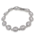 Inspire yourself in glamorous style. Carolee bracelet features oval-cut glass stones linked together in a silver tone mixed metal setting. Approximate length: 7 inches.