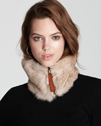 With an oversized suede zipper, Catherine Parra's fur neckwarmer is a statement-making piece to stay warm.