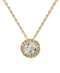 Brighten your look with style that shines! Swarovski's chic circular pendant features a round-cut crystal center stone surrounded by a halo of glittering crystals. Setting and chain crafted in gold tone mixed metal. Approximate length: 15 inches. Approximate drop: 3/4 inches.