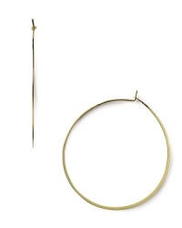 A striking yet slim silhouette makes these classic hoop earrings feminine and refined. From MICHAEL Michael Kors.