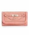 Add a little glam to your life. This sleek clutch style from GUESS features the classic script logo at front with and a sparkling faux turnlock accent.