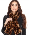 Feel fabulously fierce in this leopard print faux fur scarf from Calvin Klein. The convenient pull through design keeps you cozy even on the coldest days.