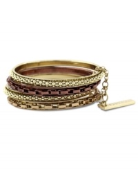 Stack up like crazy with this bracelet set by BCBGeneration. Four circular bangles create an edgy look in rose-gold tone, gold tone and chocolate tone mixed metal. Approximate diameter: 2-1/2 inches.