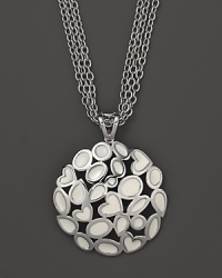 A bold sterling silver and white enamel pendant featuring a cluster of hearts on a triple-chain necklace. From Fifth Season by Roberto Coin.