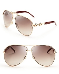 Gucci's aviator sunglasses shine in gold with the luxury brand's signature chain link details.