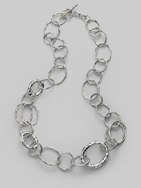 Gently hammered freeform links of sterling silver in an array of sizes and shapes give a classic chain a whole new look. Sterling silver Length, about 23 Toggle clasp Imported