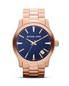 This Michael Kors watch has all the substance without a lag in style, designed with a handsomely sized round face, with a striking navy dial as the complement.