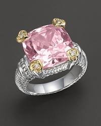 Faceted pink crystal stone ring is offset by four heart-shaped diamond accents set in 18 Kt. gold. Textured sterling silver band. Designed by Judith Ripka.