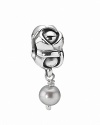 A sterling silver floral charm with an elegant grey freshwater pearl. By PANDORA.