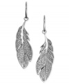 Your new feather friends from Fossil. These drop earrings features glitzy feather pendants. Crafted in silver tone mixed metal. Approximate drop: 1-3/4 inches.