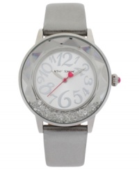 Glistening crystals swim in a faceted bezel on this elegant watch from Betsey Johnson.