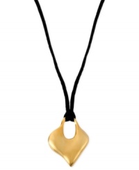 A heart that's in the right place. Robert Lee Morris puts this pendant, crafted from gold-tone mixed metal and held by a necklace cord, front and center. Approximate length: 16 inches + 3-inch extender. Approximate drop: 1-3/8 inches.