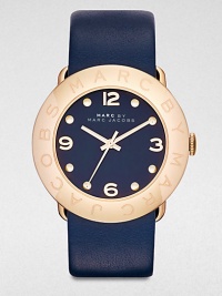 A radiant goldtone ion-plated stainless steel design with a supple leather strap. Quartz movementWater resistant to 5 ATMRound goldtone ion-stainless steel case, 36mm (1.4)Logo engraved bezelNavy dialDot and numeric hour markersSecond hand Navy leather strapImported