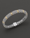 Ten golden dividers on the sterling silver Caviar™ beaded oval rope bracelet, designed by Lagos.