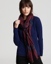 In a burgundy and blue Burberry check, this oblong scarf offers lightweight luxe with its sheer, gauzy fabrication.