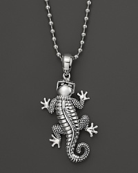 A sunglasses-adorned gecko dangles from a sterling silver ball chain on this everyday necklace from Lagos.