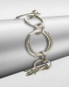 From the Bamboo Collection. Striking bamboo-motif links of various sizes form a simple yet elegant bracelet.Sterling silverLength, about 7.25Width, about .8Hinged link claspMade in Bali