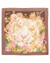 An oversized silk scarf with a colorful floral and leopard print, a fierce style from Salvatore Ferragamo.