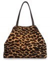 Make a fierce fashion statement with this alluring animal print shopper from DKNY. The elegant contoured design is crafted from come-hither haircalf with soft leather trim and golden hardware detail, making it this season's essential savage beauty.