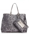 A classic silhouette gets a glam update in shimmery sequin that's absolutely eye-catching. The spacious interior features plenty of pockets to ensure all your belongings stay safe, while the complementary wristlet keeps ID, cash and cards close at hand.