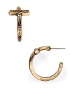 Bring cool-girl edge to your look with these engraved cross hoop earrings from House of Harlow 1960.