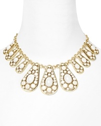 kate spade new york stacks the deck with this wow-worthy piece, featuring epoxy filled teardrops and gold-plated accents. It's a fresh, and wholly eye-catching spin on the statement necklace.