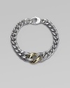 A chunky strand of graduated sterling silver links includes two with a cabled texture and one of smooth 18k gold. Sterling silver and 18k yellow gold Length, about 7½ Lobster clasp Made in Italy