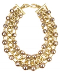 Give in to the drama. AK Anne Klein's dramatic necklace boasts warm hues with plastic pearl beads and heavy linked chains. Set in gold tone mixed metal with a hook closure. Approximate length: 16 inches + 2-inch extender.