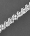 Seemingly endless diamonds enrapture and enthrall on this stunning diamond bracelet. Round-cut diamonds (5 ct. t.w.) set in 14k white gold. Approximate length: 7-1/4 inches.