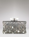 The ultimate in nighttime luxury: This leather Overture Judith Leiber clutch flaunts an au courant boxy shape, detailed with a pushlock closure and chunky-chic stones.