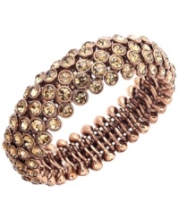 Craving chocolate? Add rich brown tones to your look in Charter Club's chic design. Bracelet set in brown gold tone mixed metal with sparkling brown glass accents. Bracelet stretches to fit the wrist. Approximate diameter: 2-1/4 inches.