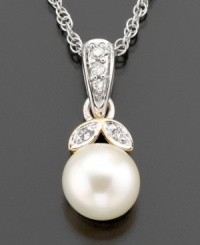 Fresh and joyful, this breathtaking pendant features cultured freshwater pearl (7mm) and diamond accents set in 14k gold and sterling silver. Approximate length: 18 inches. Approximate drop: 1/2 inch.