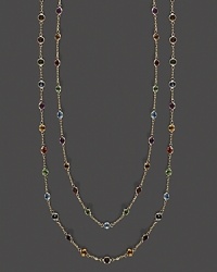 A brilliant medley of faceted semi-precious stones set in a long, luxe 14K yellow gold necklace