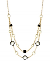 Be bold with some help from Anne Klein. This beaded necklace highlights plastic jet and pearl accents. Crafted in gold tone mixed metal. Approximate length: 16 inches + 2-inch extender.