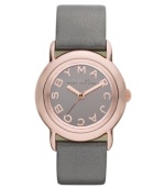 Tastefully trendy. The perfect amount of shimmer and shine accents this watch by Marc by Marc Jacobs. Metallic gray leather strap and round rose-gold ion-plated stainless steel case. Gray mirrored dial features rose-gold tone logo letters at markers and three hands. Quartz movement. Water resistant to 50 meters. Two-year limited warranty.