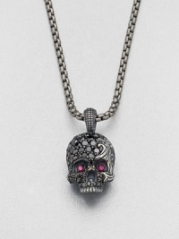 Eye-catching rubies and black diamonds embellish this edgy skull design of sterling silver, suspended from a link chain.Sterling silver/titaniumBlack diamond/rubyAbout 9 diam.Imported