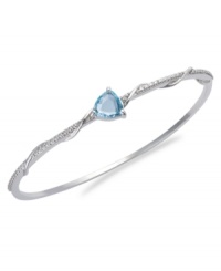 The perfect accent. Victoria Townsend's beautiful bangle features a trillion-cut blue topaz (3 ct. t.w.) and sparkling diamond accents. Set in sterling silver. Approximate length: 8 inches.