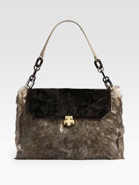 A luxurious toscana lamb fur body with an astrakhan lamb fur flap accented with a leather bottom.Resin and metal chain and leather shoulder strap, 9 dropTurnlock flap closureOne inside zip pocketTwo inside open pocketsCotton lining13W X 9½H X 3DImported