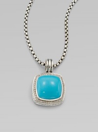 From the Albion Collection. Dazzling diamonds surround this smooth, domed turquoise stone set in sterling silver. TurquoiseDiamonds, .48 tcwSterling silverSize, about ½ Sterling silver baleImported Please note: Chain sold separately. 