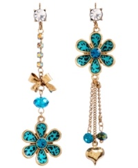 Predatorial meets pretty. The funky leopard print provides stark contrast to the petite flower details on Betsey Johnson's mismatch earrings. Crafted in gold-plated mixed metal with chain and crystal cup chain accents, blue and green faceted beads and bow and bubble heart charms. Approximate drop: 3-1/4 inches.