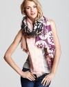 Rich pink and purple populate the bubble moon print of this stay-warm scarf from DIANE von FURSTENBERG.