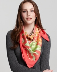 A vibrant silk scarf with a fierce jungle pattern by Salvatore Ferragamo.