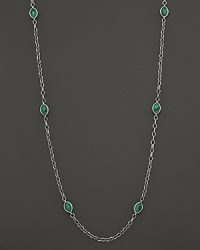 Faceted crystal and malachite are chicly framed by sterling silver Caviar™ beading and fluted oval links.