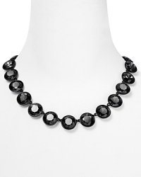 Round faceted stones light up your neckline. Necklace by Juicy Couture.